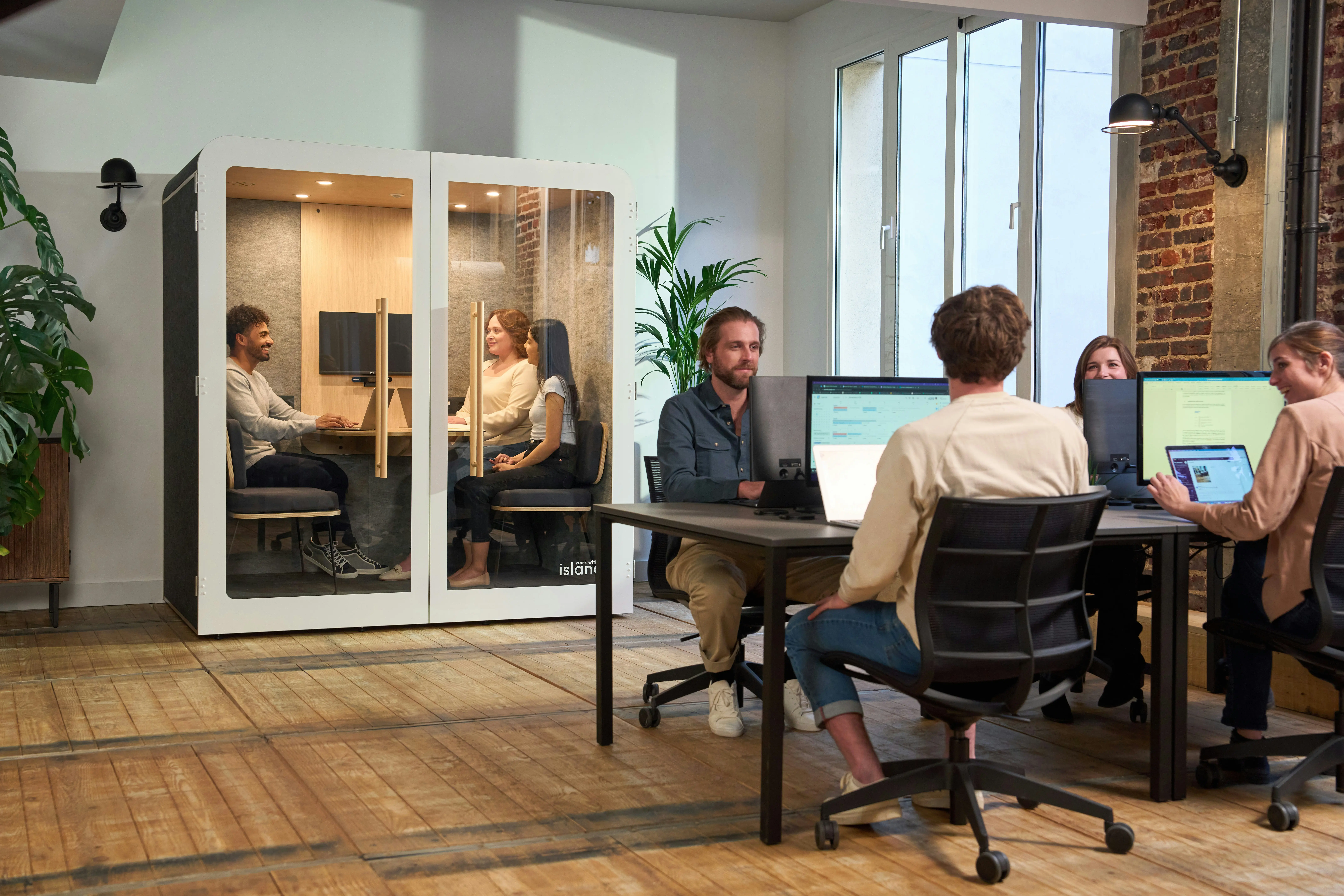 Small business team working in a modern office supported by DS Business Hub IT services